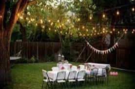 fiesta en jardin con iluminacion y con inflables